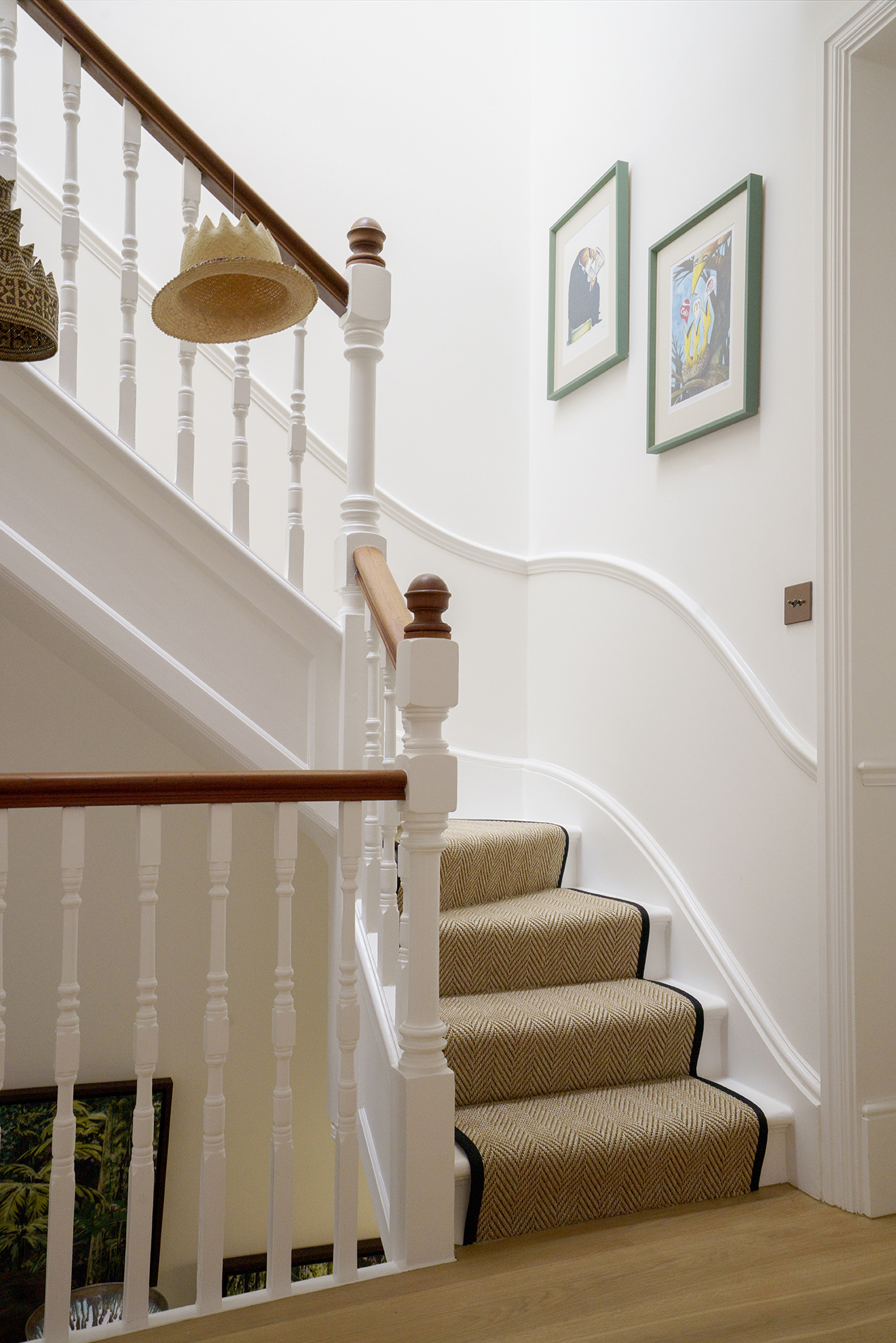 Restored Victorian fireplace within a calm residential interior by Beacham Architects, featuring bespoke joinery, soft neutral walls, and refined heritage detailing in a London home.