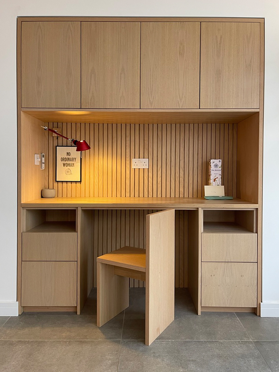 Contemporary residential house designed by Beacham Architects, featuring timber-clad pitched roofs, dormer windows, and a modern reinterpretation of a traditional London home.