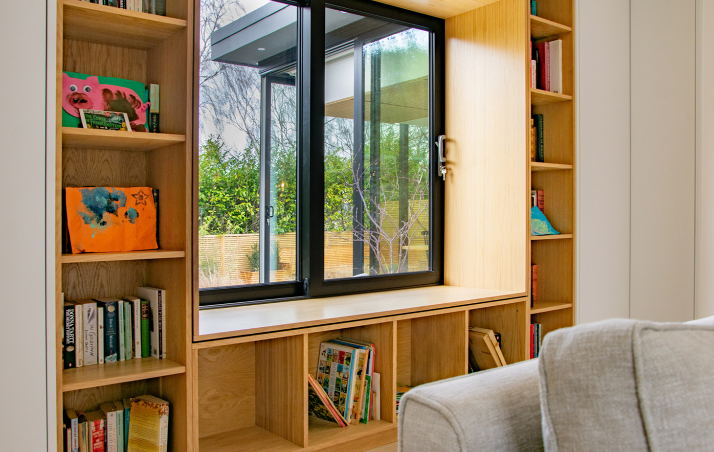 Contemporary residential house designed by Beacham Architects, featuring timber-clad pitched roofs, dormer windows, and a modern reinterpretation of a traditional London home.