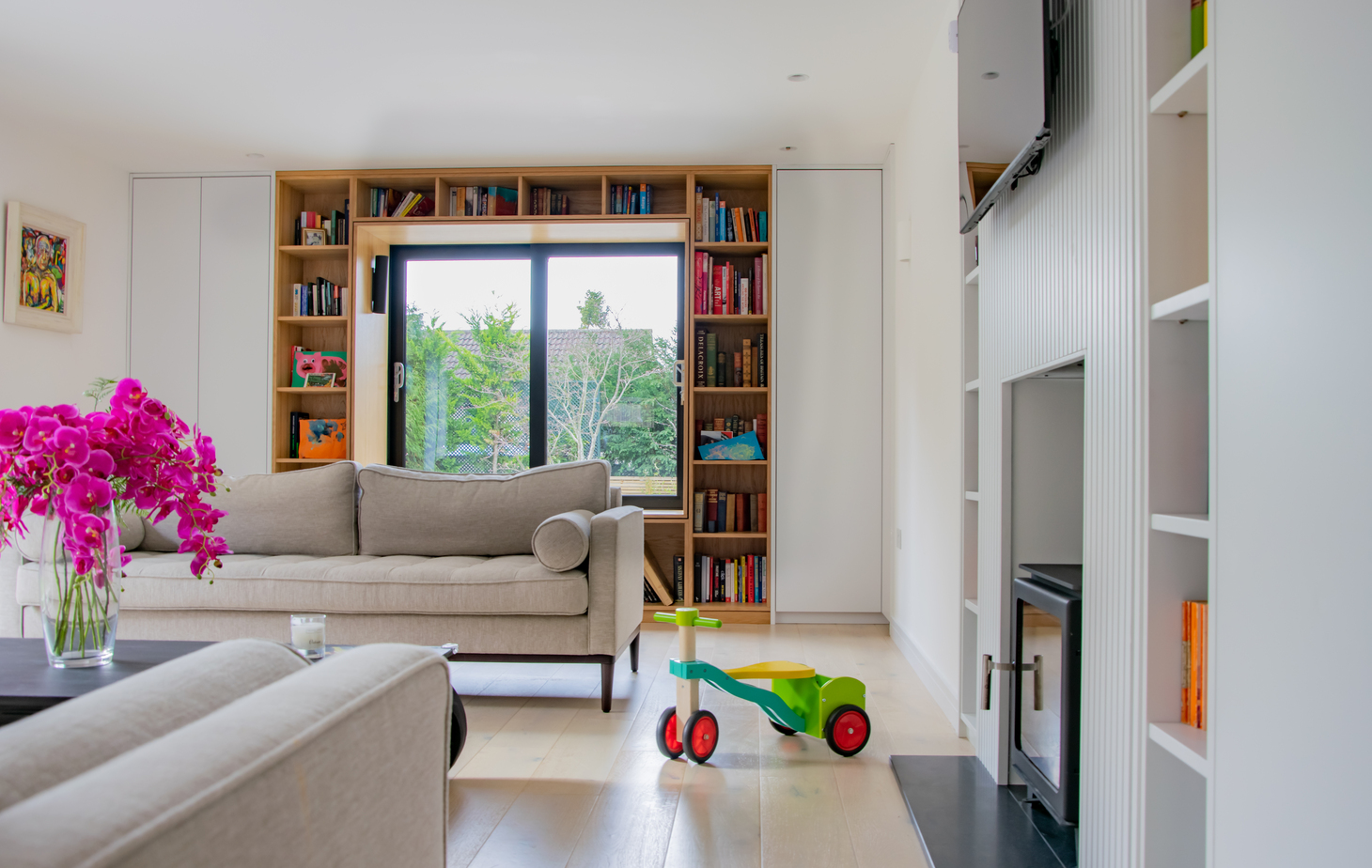Contemporary residential house designed by Beacham Architects, featuring timber-clad pitched roofs, dormer windows, and a modern reinterpretation of a traditional London home.