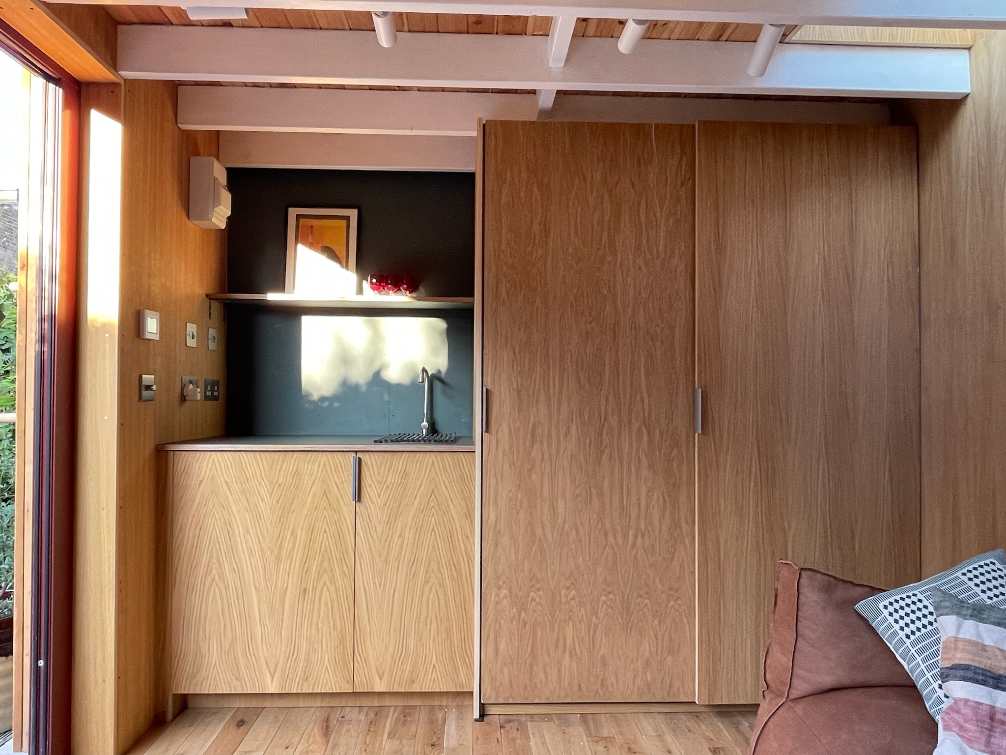 This garden room extends the living space of a mid-terrace Victorian house by 15m2, creating a light-filled, flexible environment for children’s projects, music, craft, surfboard shaping and socialising. Designed to work hard for family life, it combines practical storage and utility with considered architectural detailing.</p>
<p>