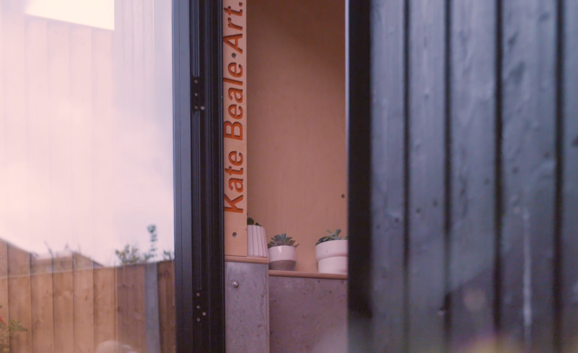 The exterior features vertically oriented burnt larch cladding, punctuated by powder-coated metal capping and window reveals, providing a refined contrast to the natural surroundings. Inside, vibrant, durable finishes balance warmth with bold colour, fostering inspiration without compromising functionality. A large stainless steel sink and generous work surfaces meet the practical demands of dyeing and fabric design.</p>
<p>This garden studio is a carefully considered space where light, materiality and functional planning support both creativity and daily work. The result is a dynamic, serene environment that invites exploration and craftsmanship.